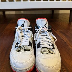 Orange, black and white Air Jordan 4s